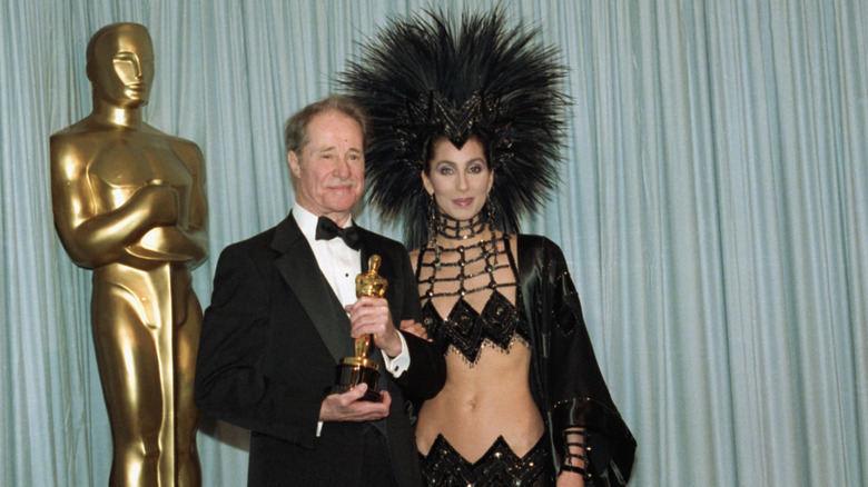 Cher at the 1986 Oscars next to Don Ameche