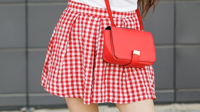Wearing gingham skirt