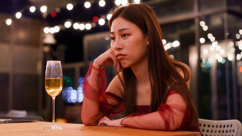 Sad at table