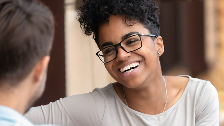 Woman smiling and flirting