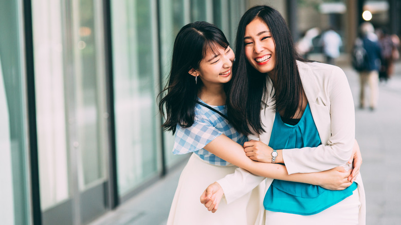 Two women hugging 