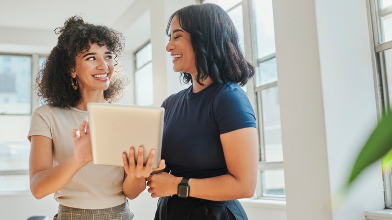 Two women talking at work