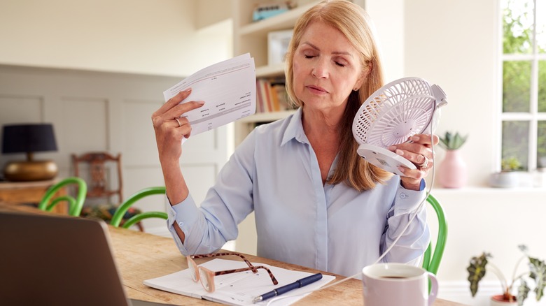 Woman fanning herself