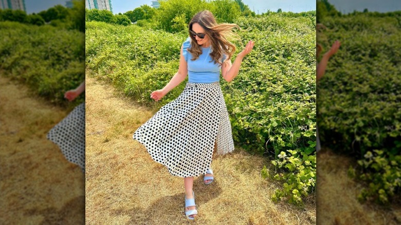 Woman in polka dot skirt
