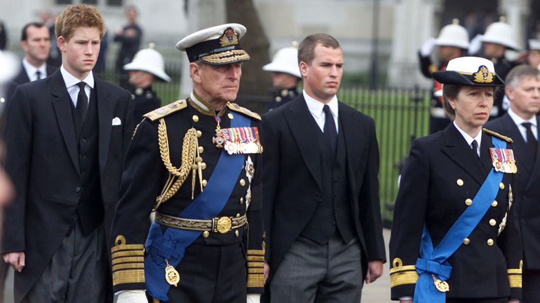 Princess Anne dressed in military uniform alongside her father, the late King Philip for a funeral