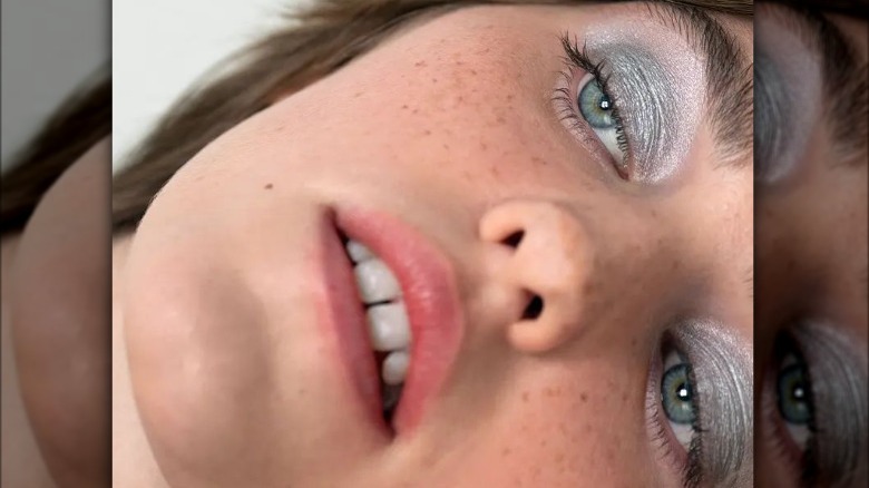 Woman wearing metallic shadow 