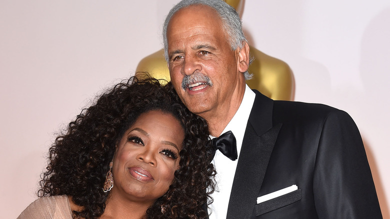 Oprah Winfrey and Stedman Graham smiles on the red carpet in 2015
