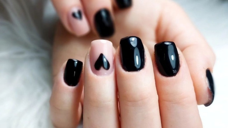 Black and beige heart nails