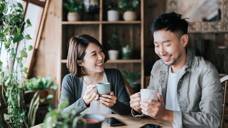 Asian couple having coffee