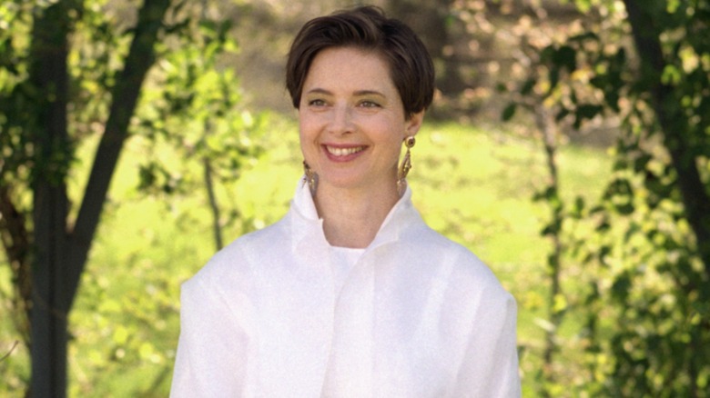Isabella Rossellini smiling while wearing an all-white outfit in 2000