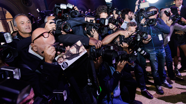 Female celebrity being photographed