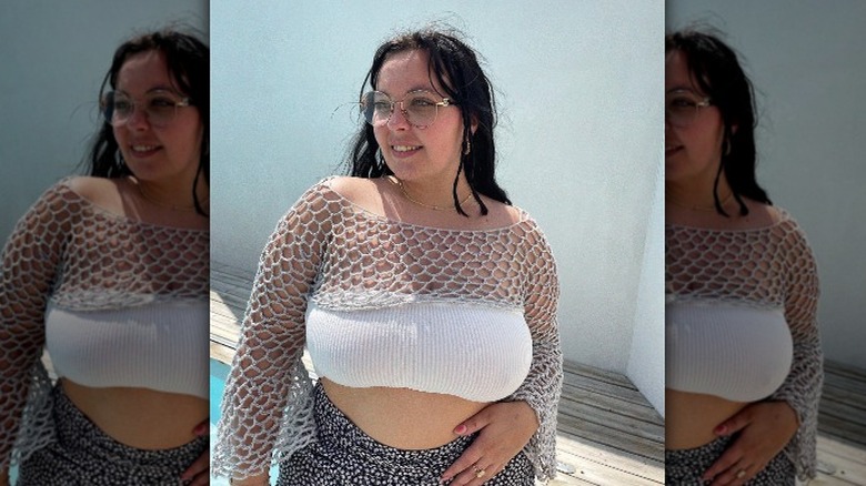 Woman in crocheted net shrug