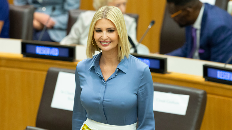 Ivanka Trump with a middle part and blonde hair in a blue top