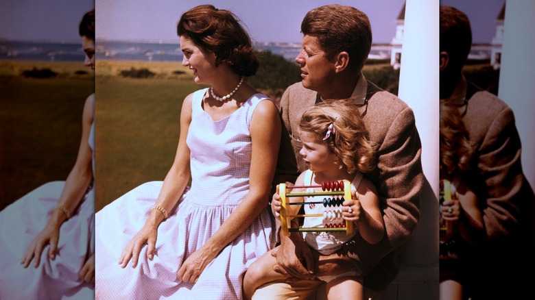 Jackie Kennedy with John F. Kennedy and their daughter Caroline Kennedy outside