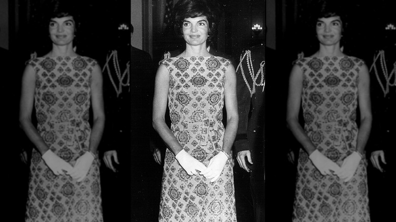A black and white photo of Jackie Kennedy in a boatneck dress