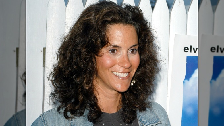 Jami Gertz smiling at a 2005 Playboy Beauty Party with shoulder length curls