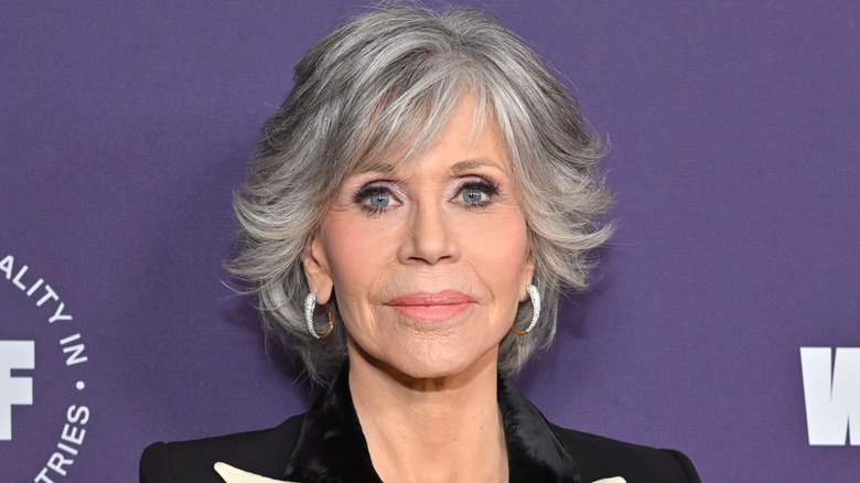 Jane Fonda in a black blazer with longer gray hair at an event
