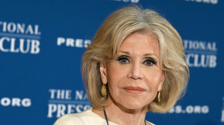 Jane Fonda with blond hair wearing a cream top