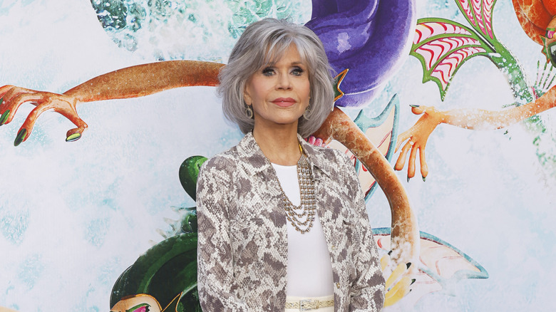 Jane Fonda with a gray bob and a gray snakeskin coat at an event