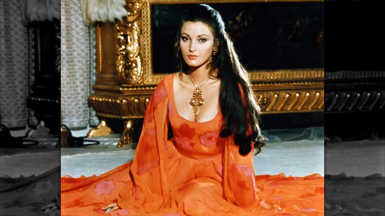 Jane Seymour posing in a red dress in 1973