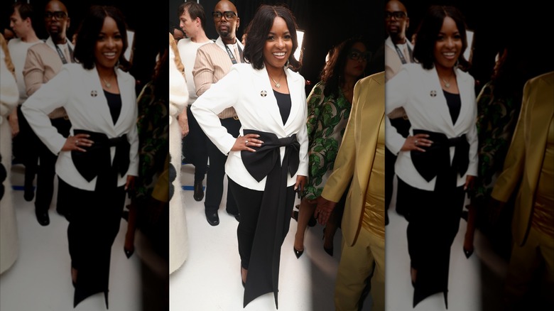 Jasmine Crockett in a white jacket with big bow