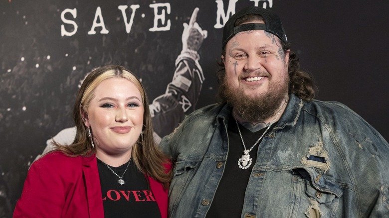 Bailee Ann DeFord posing on the red carpet with her dad Jelly Roll