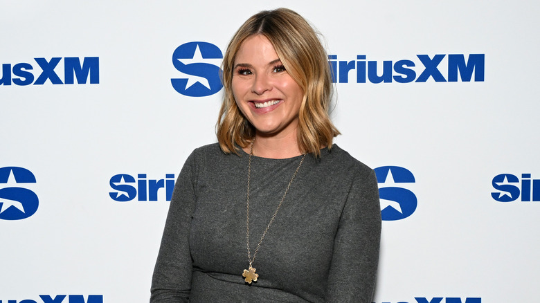 Jenna Bush Hager on the red carpet in a gray top with a long gold pendant