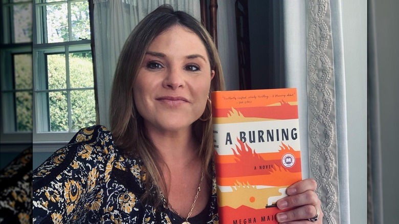 Jenna Bush Hager posing with a book in 2020 with dark roots