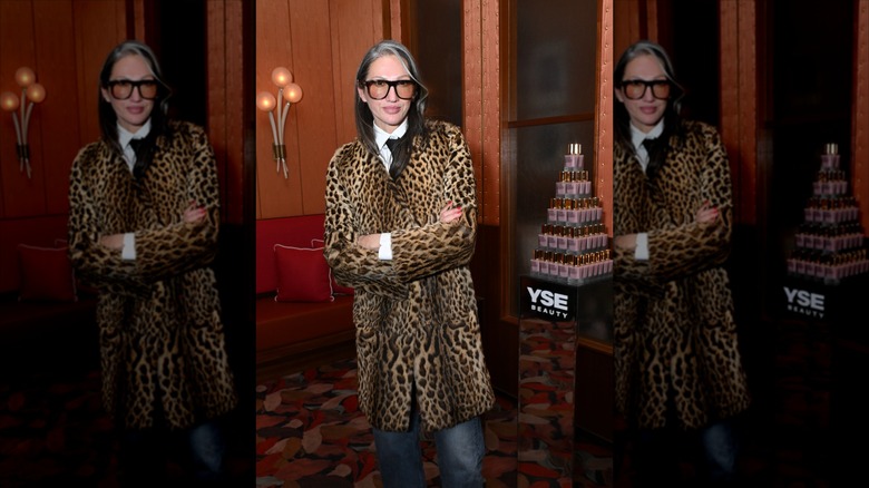 Jenna Lyons poses with her arms folded wearing a leopard print jacket