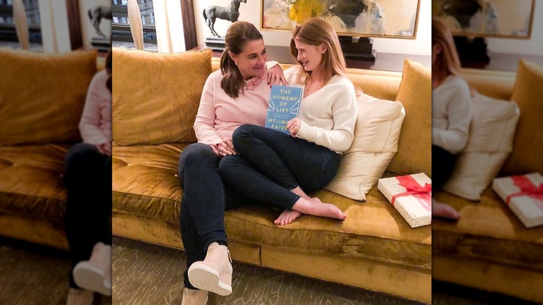 Jennifer Gates and Melinda Gates holding a copy of Melinda's book