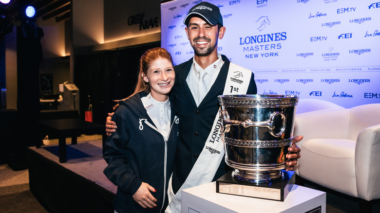 Nayel Nassar of Egypt, winner of the Longines Grand Prix de New York with his girlfriend Jennifer Gates and the trophy at the Longines Masters New York