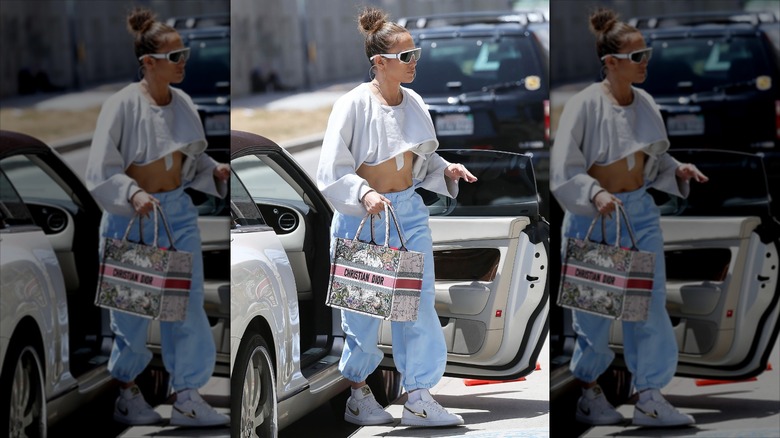 Jennifer Lopez in a white and blue sweats look with white sunglasses