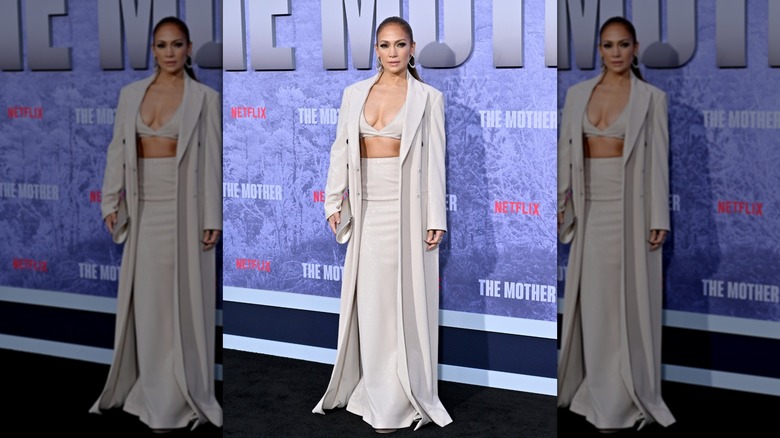 Jennifer Lopez attending the premiere of the Netflix's "The Mother" in 2023, wearing a shiny three-piece outfit