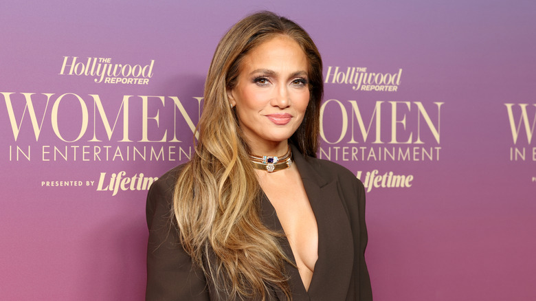 Jennifer Lopez smiling on a red carpet