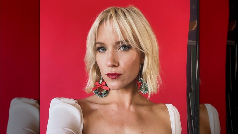 Jessy Schram takes a selfie on the set of a shoot in November 2023