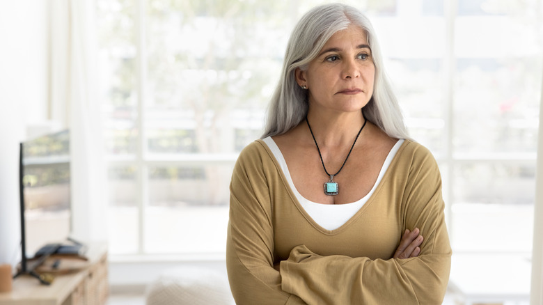 Older woman in turquoise pendant