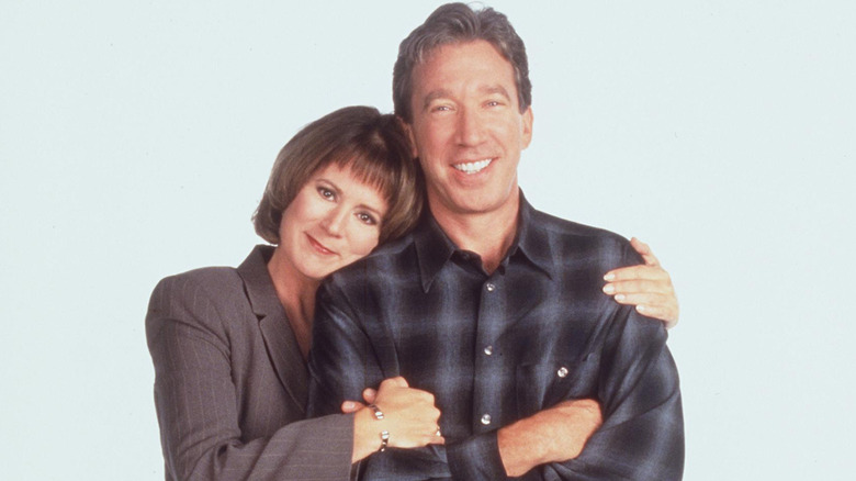 Patricia Richardson posing with Tim Allen in 1998 for "Home Improvement"