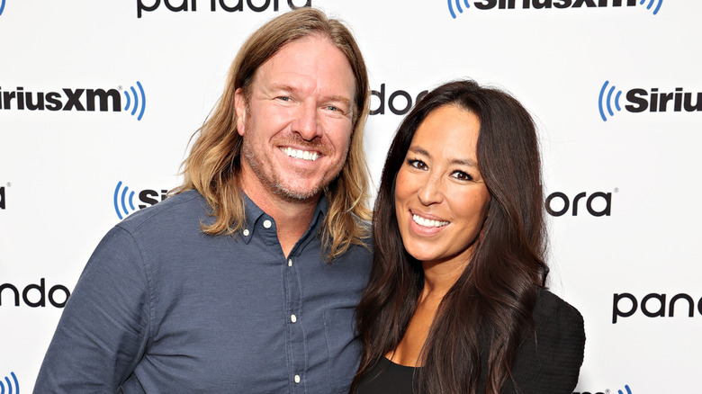 Joanna and Chip Gaines smile on the red carpet in 2021