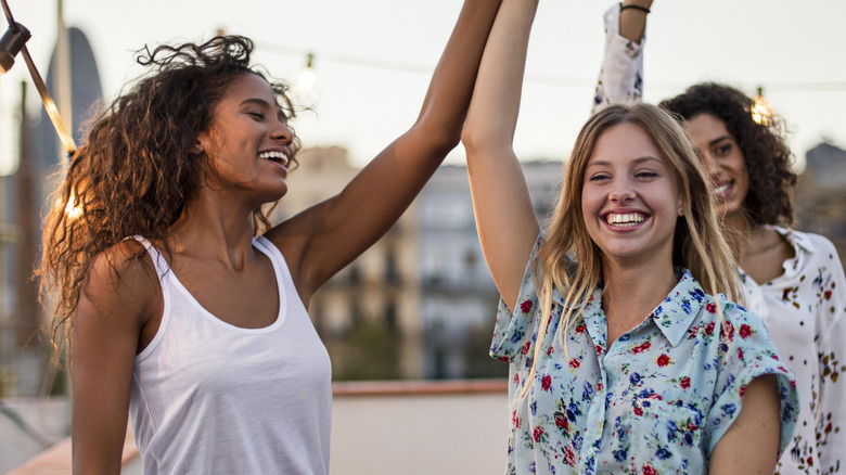 women dancing together