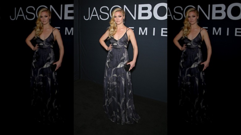Julia Stiles wearing a blue and silver maxi dress with a deep side part