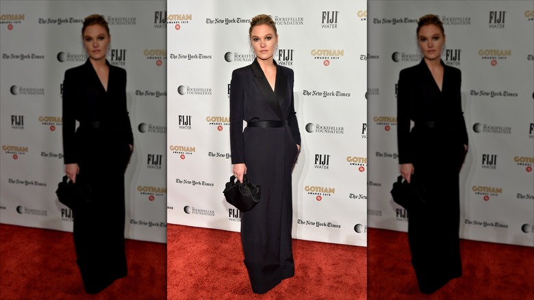 Julia Stiles wearing a tailored suit-inspired maxi dress