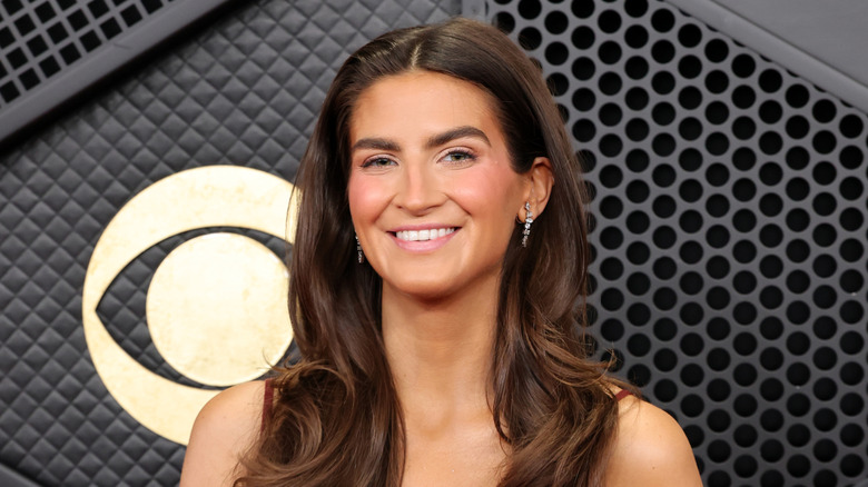 Kaitlan Collins smiling for the camera at the 68th GRAMMY Awards