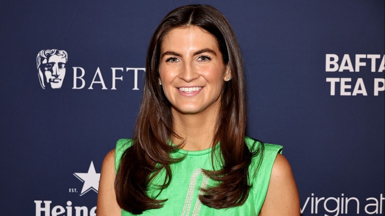 Kaitlan Collins smiling while posing at a 2024 event