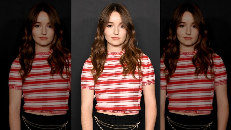 Kaitlyn Dever posing with a long, wavy hairstyle at a 2022 event
