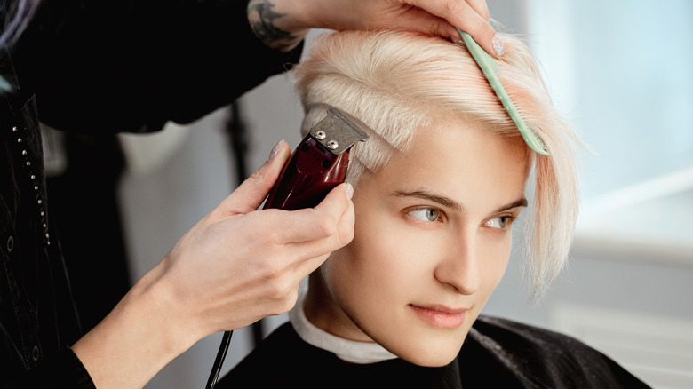 Person getting bold haircut