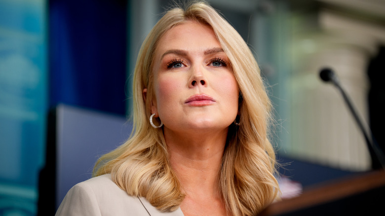 Close-up of Karoline Leavitt looking out into the crowd during a press event