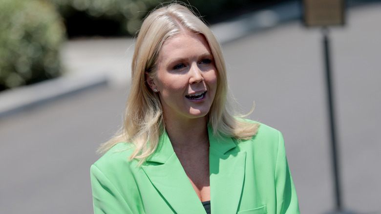 Caroline Leavitt wearing a lime green suit