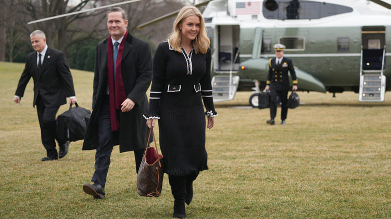 Karoline Leavitt in a black dress with an outdated bag in February 2025