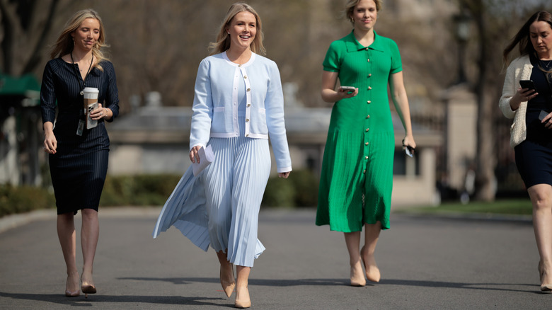 Karoline Leavitt in a monochromatic baby blue skirt and jacket in spring 2025