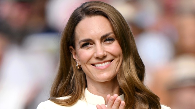 Kate Middleton smiling with her hands together